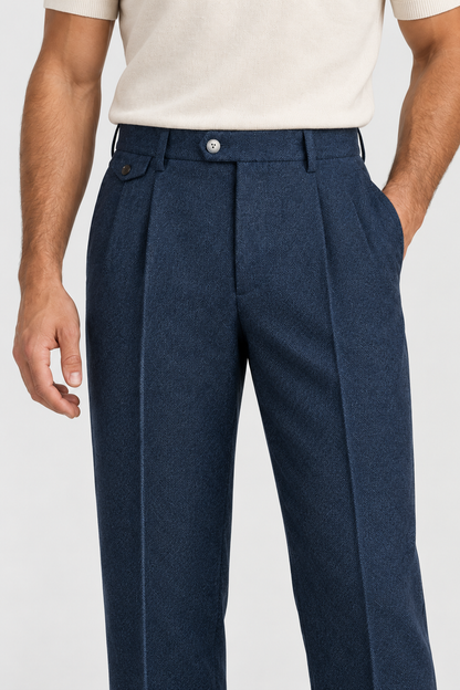Navy pleated trousers, waistband and pleat detail